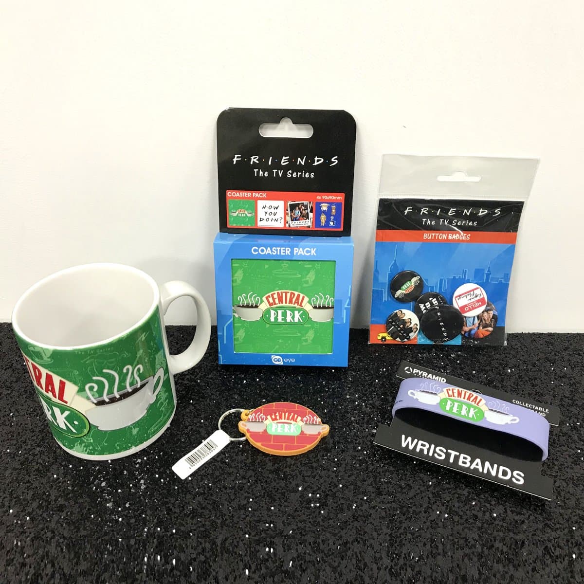 Friends Central Perk Gift Set Bundle - including a Central Perk Mug, Keyring, Badge Pack, Set Of Coasters and Rubber Wristband.